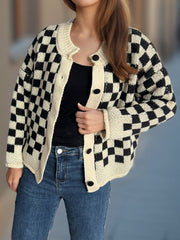 Checkerboard knit button-up cardigan in black and cream with button details.