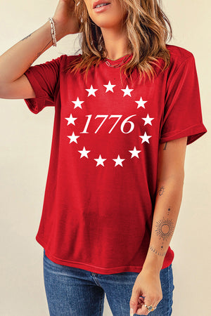 Red graphic t-shirt with a white 1776 starburst design, crew neck, short sleeves.
