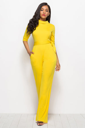 Yellow high-neck belted palazzo jumpsuit with three-quarter sleeves and pockets.