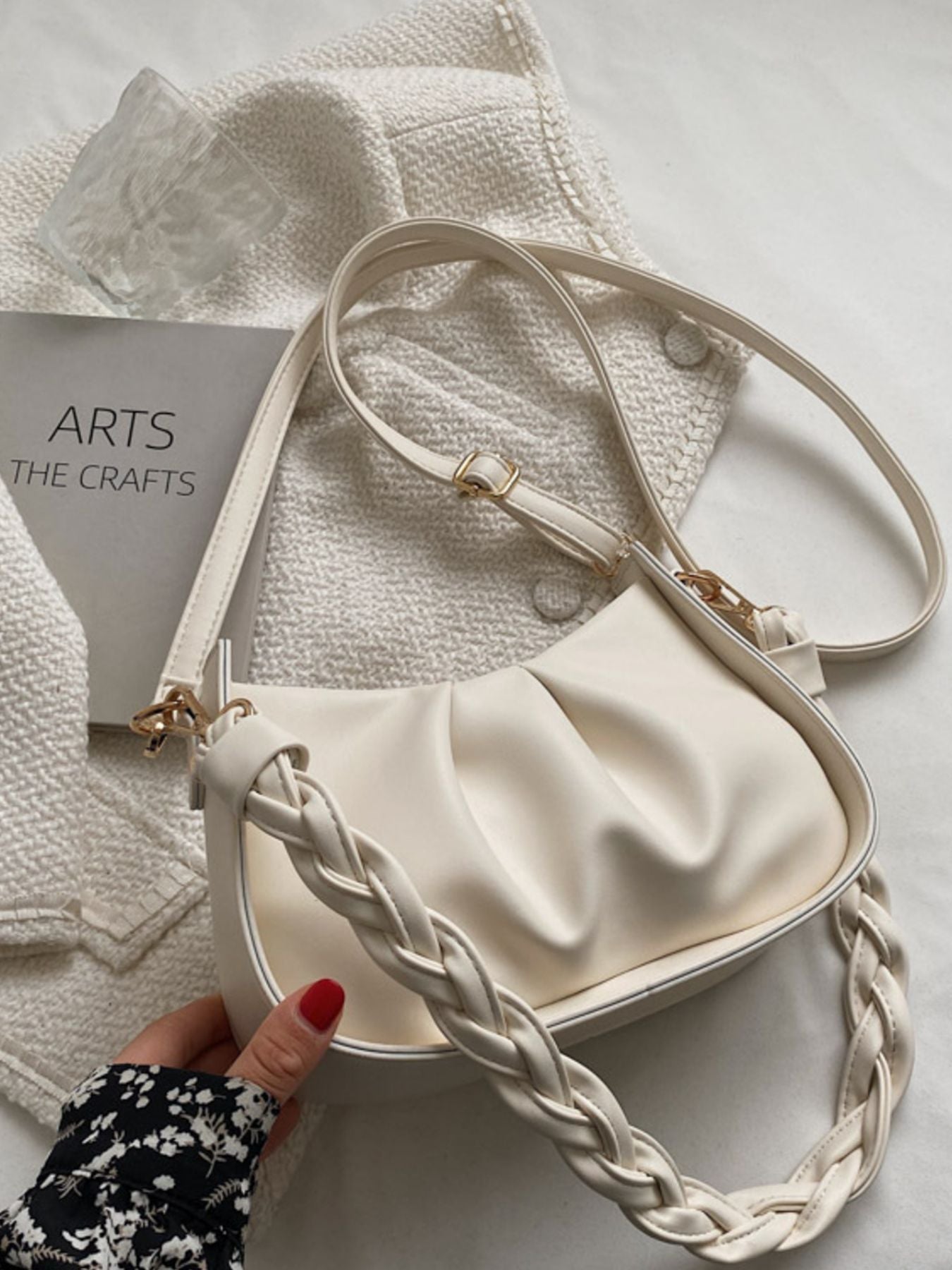 White ruched crossbody bag with braided strap and gold hardware