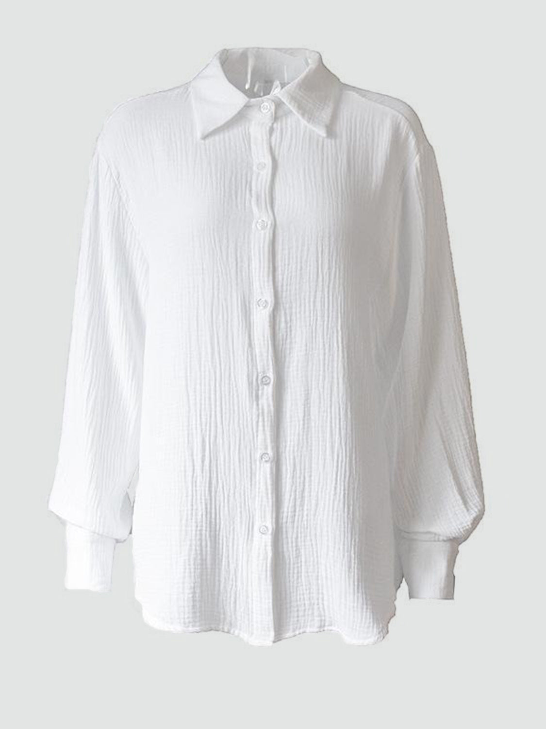 Textured cotton overshirt in white with relaxed fit and button front.