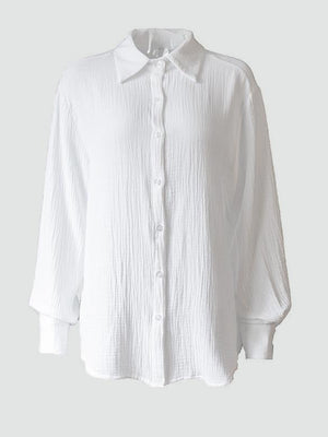 Textured cotton overshirt in white with relaxed fit and button front.