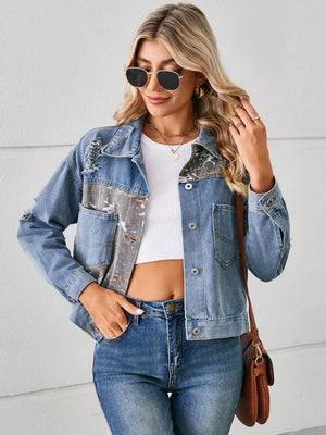 Denim trucker jacket with serpentine print, distressed details, and button-down pockets.
