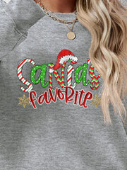 Gray crewneck sweatshirt with Santa's Favorite graphic, red and green candy cane stripes, polka dots, and snowflakes.