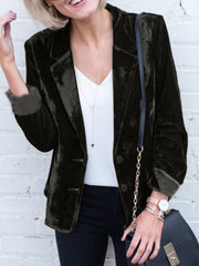 Black velvet tailored blazer with button closure and cuffed sleeves.