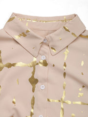 Tan blouse with gold brushstroke print and button front