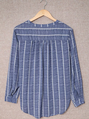 Dusty blue striped V-neck buttoned blouse with long sleeves and a relaxed fit.