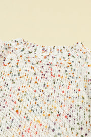 Cream speckled knit sweater with crew neck and ribbed details.