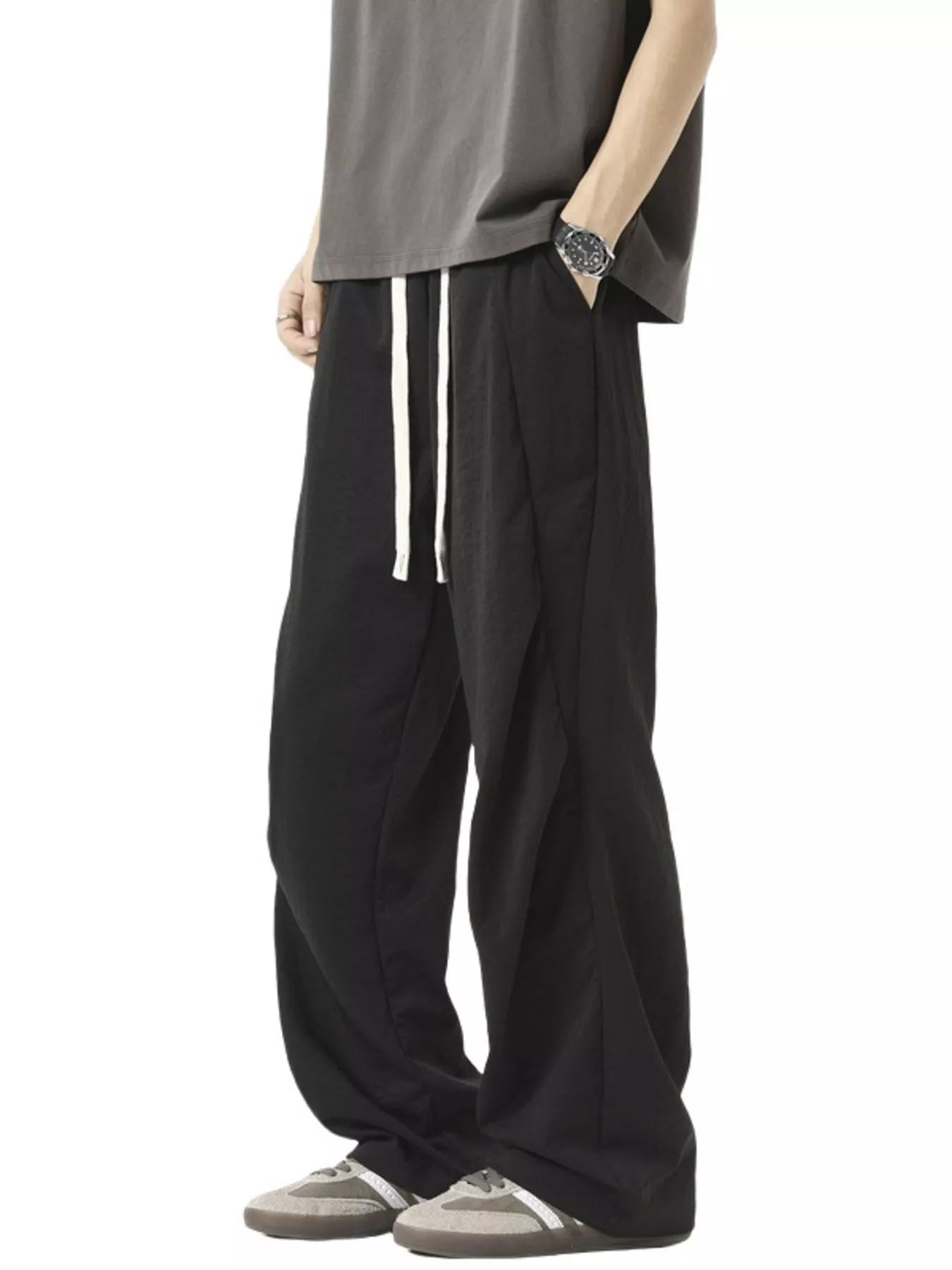 Black plus-size loose fit drawstring pants with a comfortable fit.