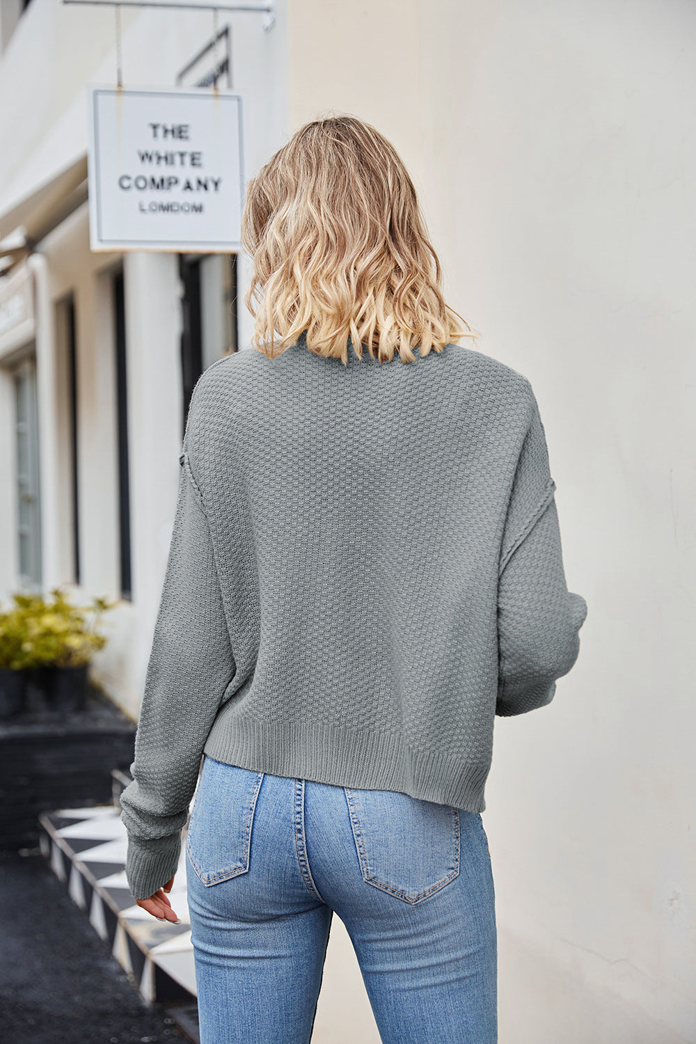 Textured knit cropped cardigan in Cloudy Blue with button details.