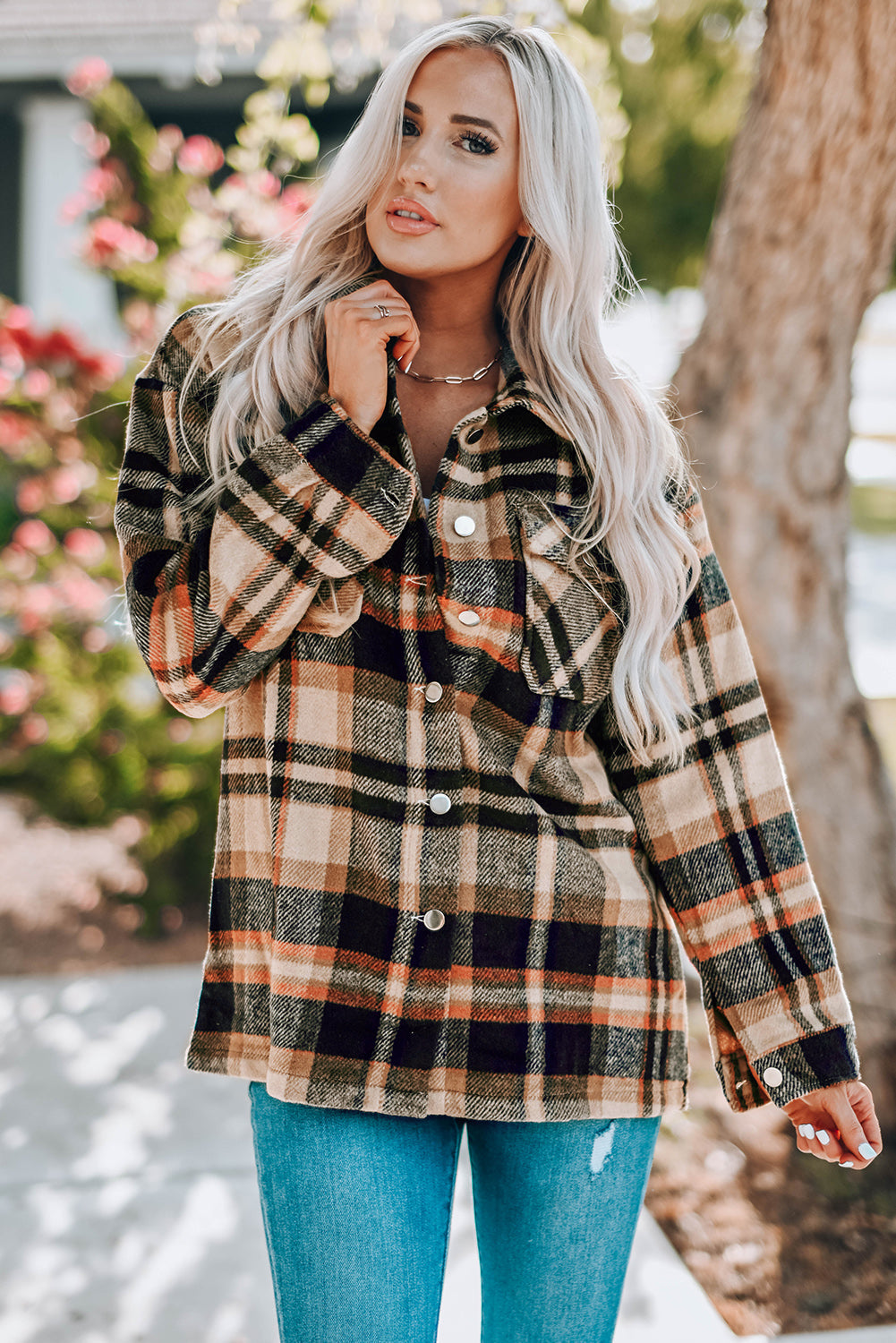 Soft plaid shacket with patch pockets and button front, in tan and black plaid.