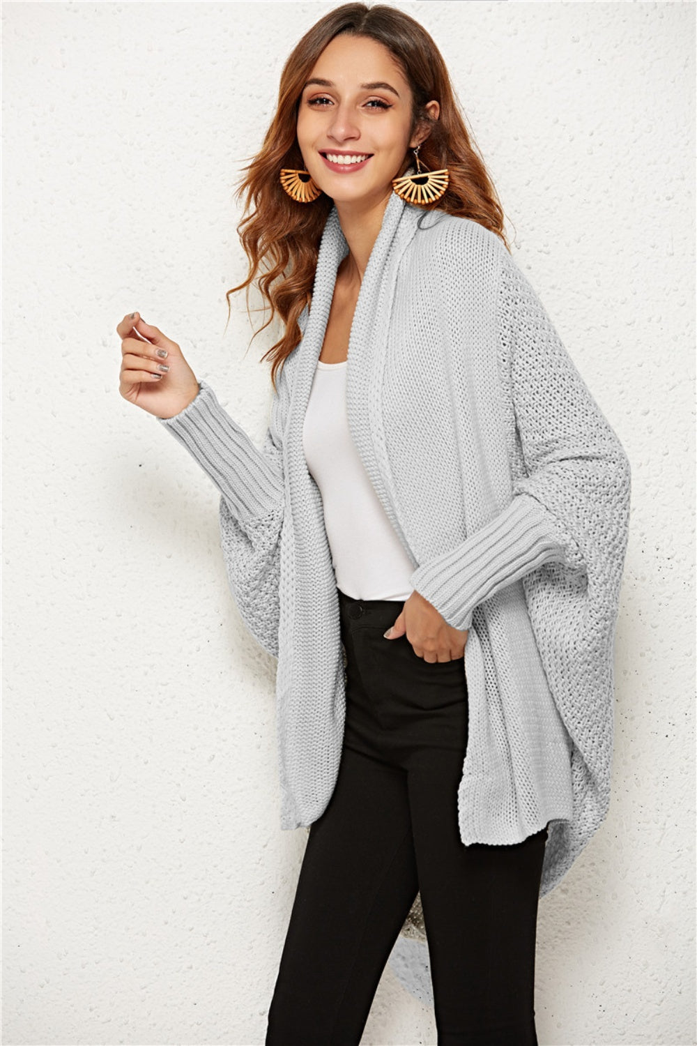 Light gray cocoon knit cardigan with shawl collar and batwing sleeves.