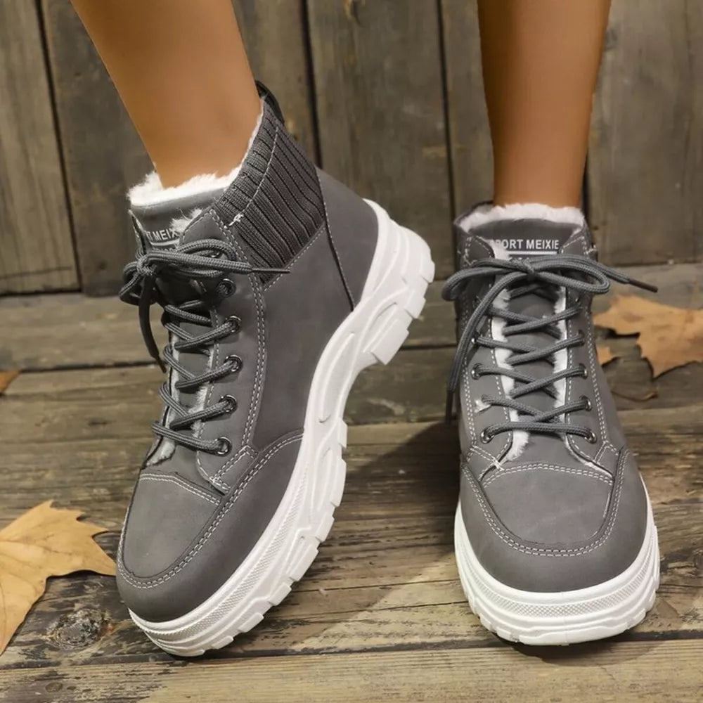 Dark gray lace-up boots with plush lining and knit ankle accents.
