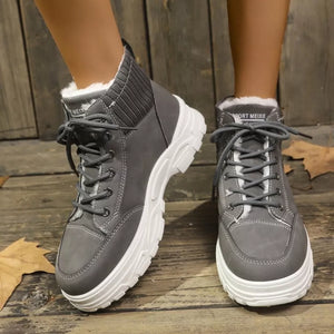 Dark gray lace-up boots with plush lining and knit ankle accents.