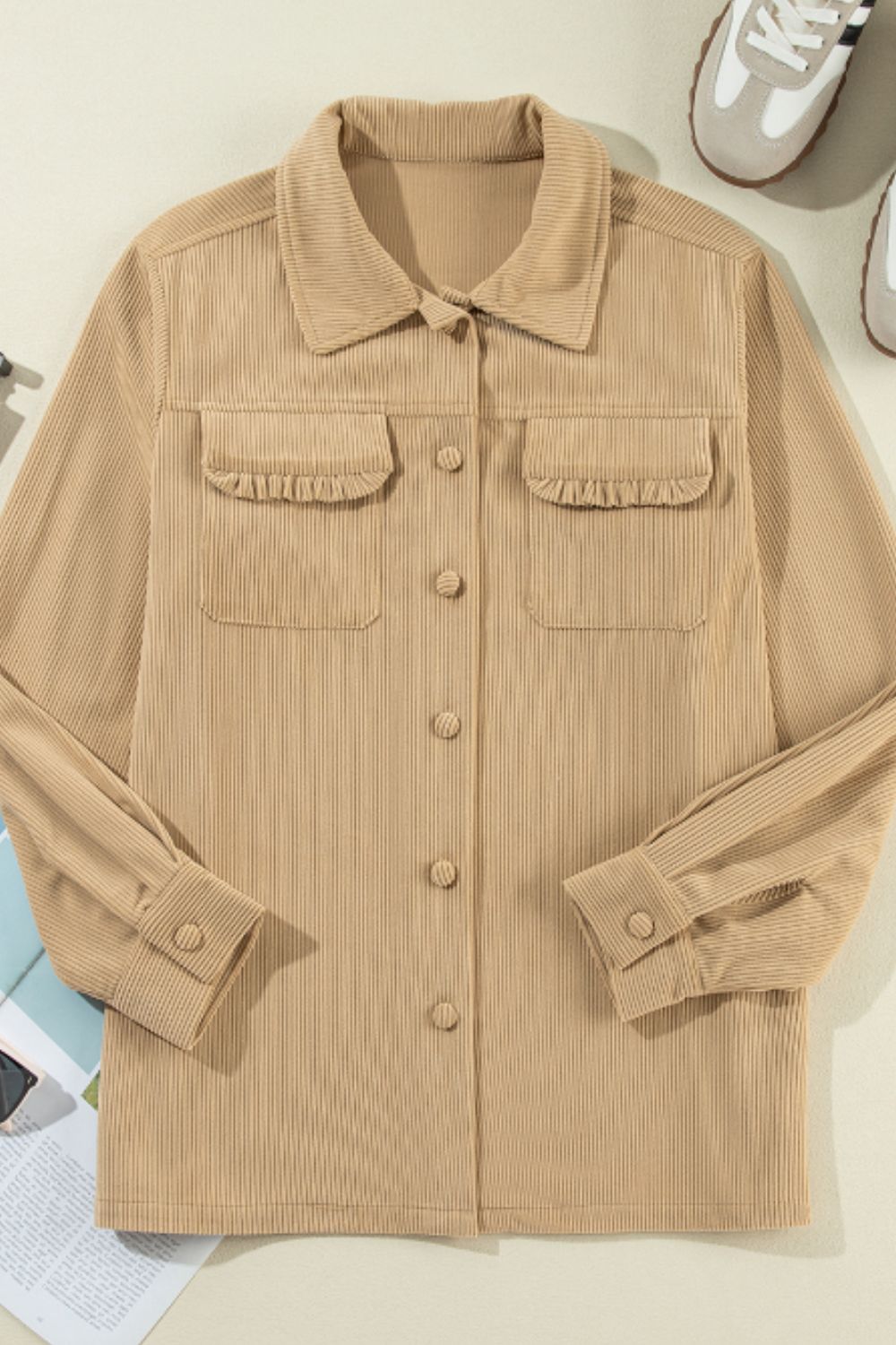 Tan corduroy utility shirt with ruffled chest pockets and button front.