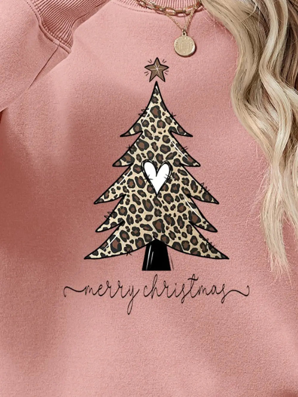 Blush pink sweatshirt with leopard print Christmas tree graphic and merry christmas text