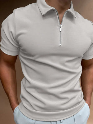 Gray zip-front polo shirt with short sleeves and a streamlined fit.