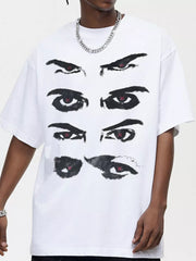 White cotton t-shirt with a bold black eye graphic and red accents.