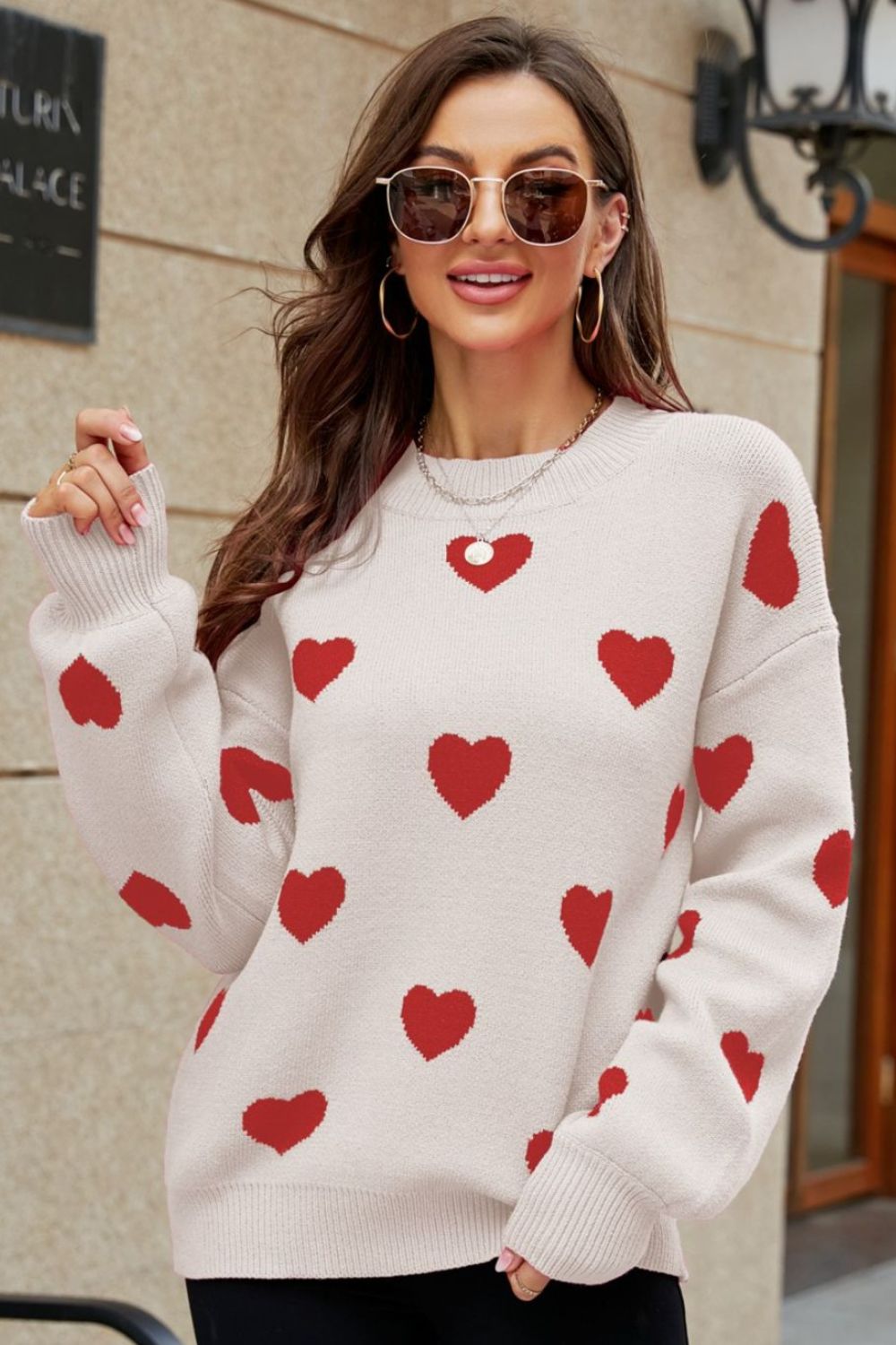 Heartbeat Jacquard Balloon Sleeve Knit sweater in beige with red hearts, crewneck, and ribbed cuffs.