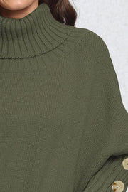 Green knit turtleneck sweater with button cuffs