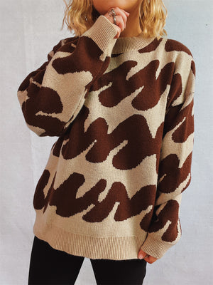 Graphic Wave Knit Sweater in camel and dark brown with a crew neck and long sleeves.