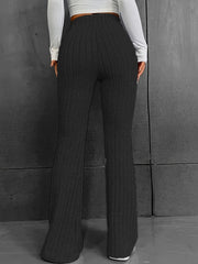 Black ribbed flare trousers made of 100% polyester with a high waist.