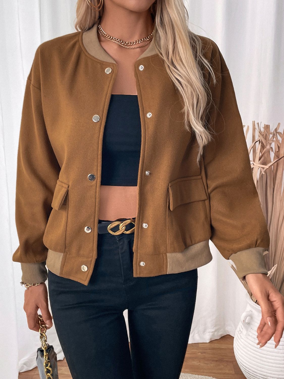 Caramel felted wool-blend bomber jacket with button front and flap pockets.