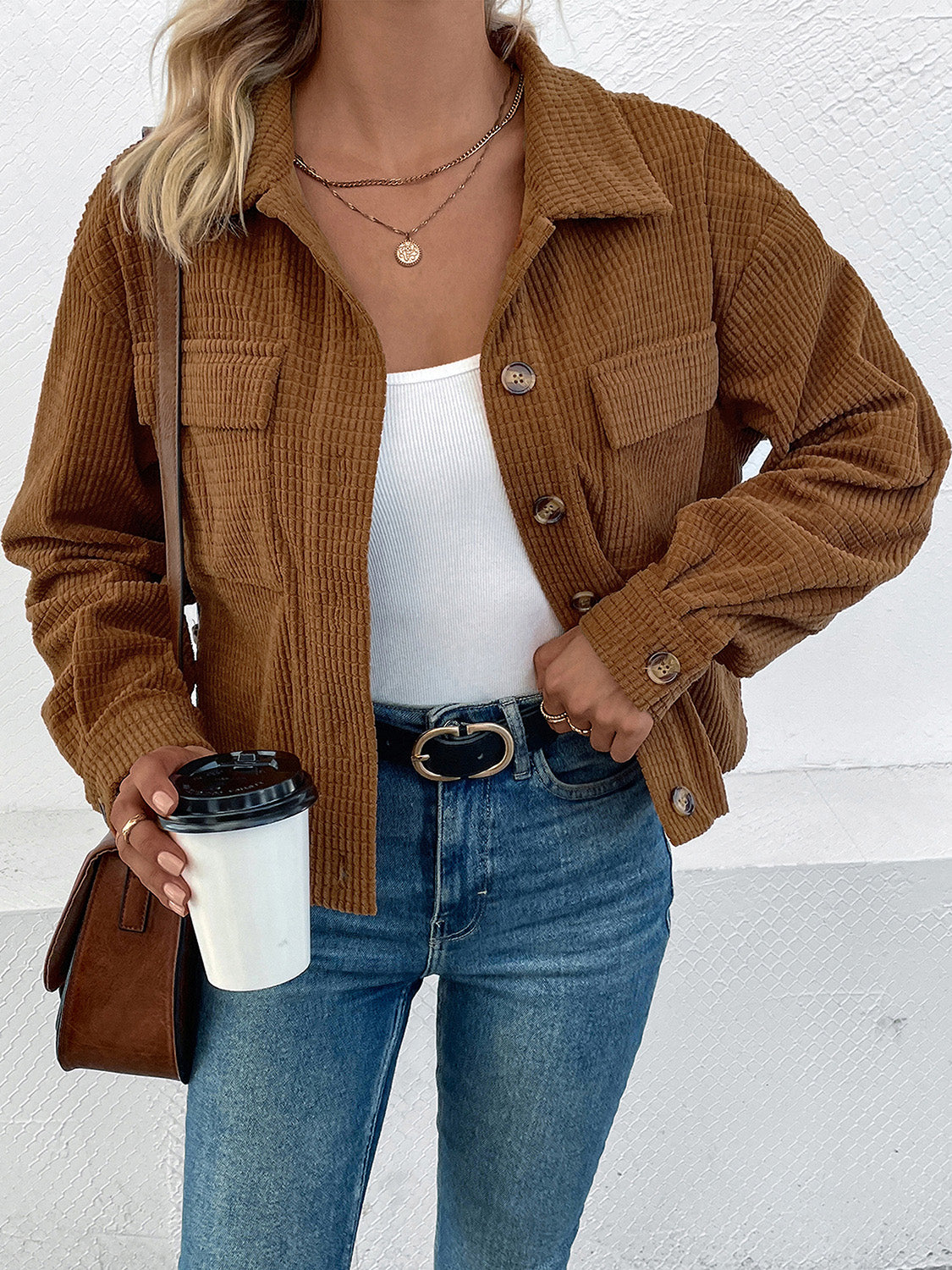 Textured corduroy cropped shirt jacket in camel with button details and chest pockets.