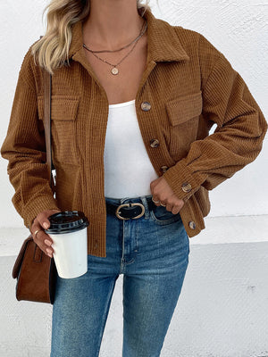 Textured corduroy cropped shirt jacket in camel with button details and chest pockets.