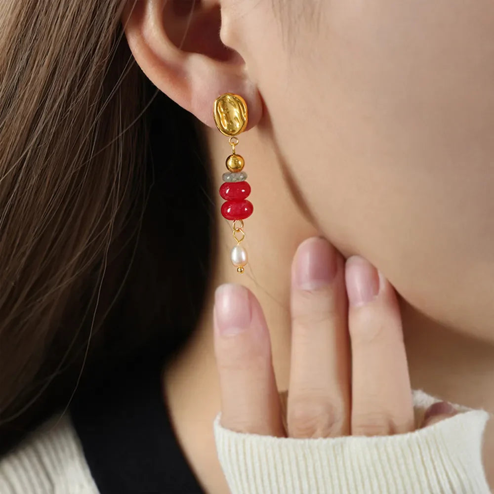 18K gold-plated dangle earrings with red stacked gemstones and a pearl drop.