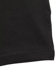 Black long-sleeve ruched dress with a slit detail.