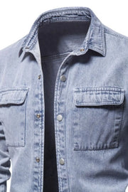 Light faded denim utility shirt jacket with two chest pockets and button front.