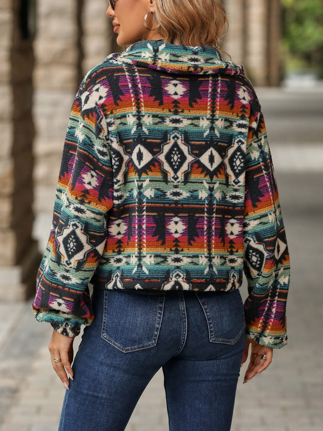Southwestern sherpa button-up jacket in multicolor with geometric pattern and balloon sleeves.