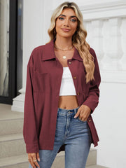 Burgundy corduroy overshirt with button front and chest pockets, styled casually.
