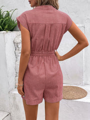 Dusty pink striped shirting romper with short sleeves, collared neckline, and cinched waist tie.