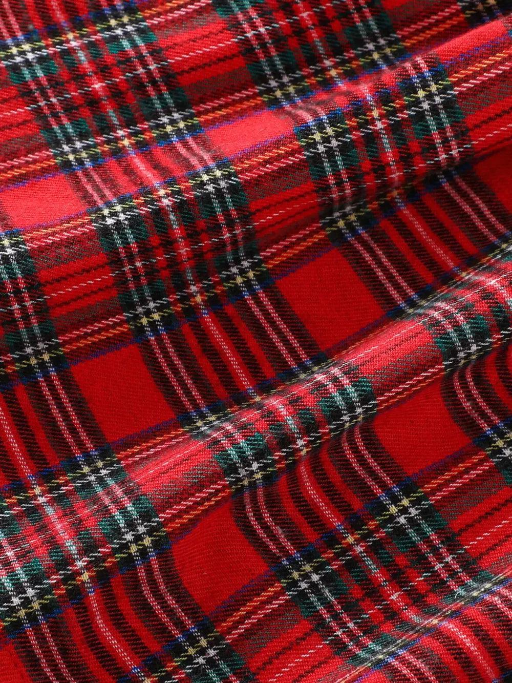 Baby dress in red plaid cotton blend fabric with embroidered details.
