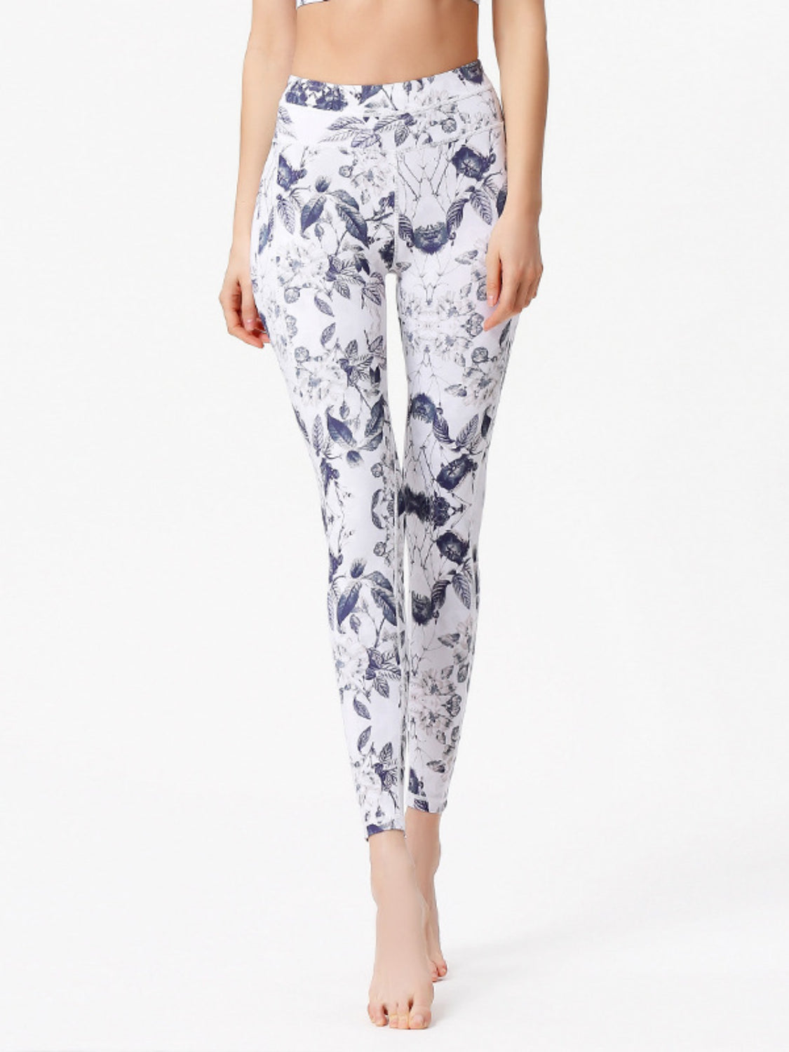 White leggings with a navy cosmic floral print and piping detail.