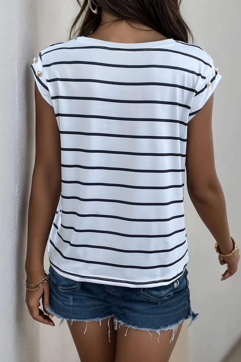 Button-shoulder stripe tee with cap sleeves in black and white stripe.