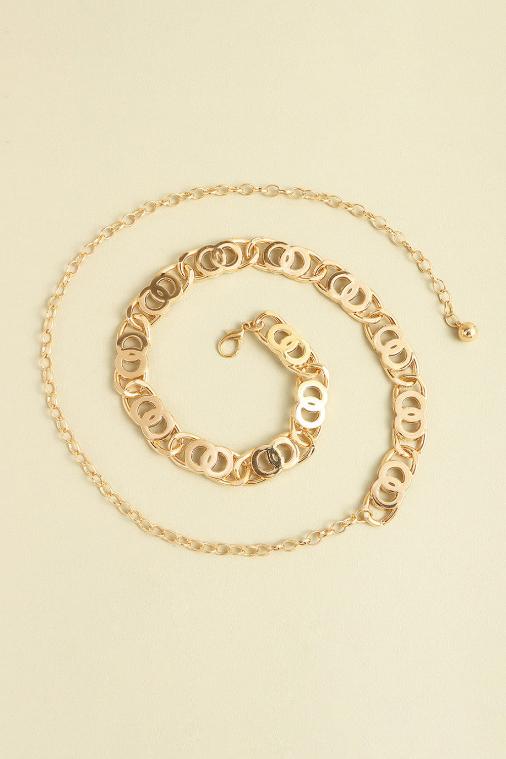 Golden circle chain belt with lobster clasp and extender chain.