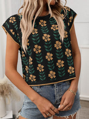 Black floral knit sleeveless top with yellow flowers and green leaves, featuring a crew neck and gold trim.