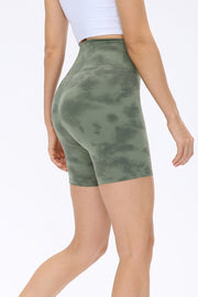 Matcha green tie-dye bike shorts with a high waist.