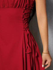Deep red cami dress with crisscross lace-up side detail and tie accents
