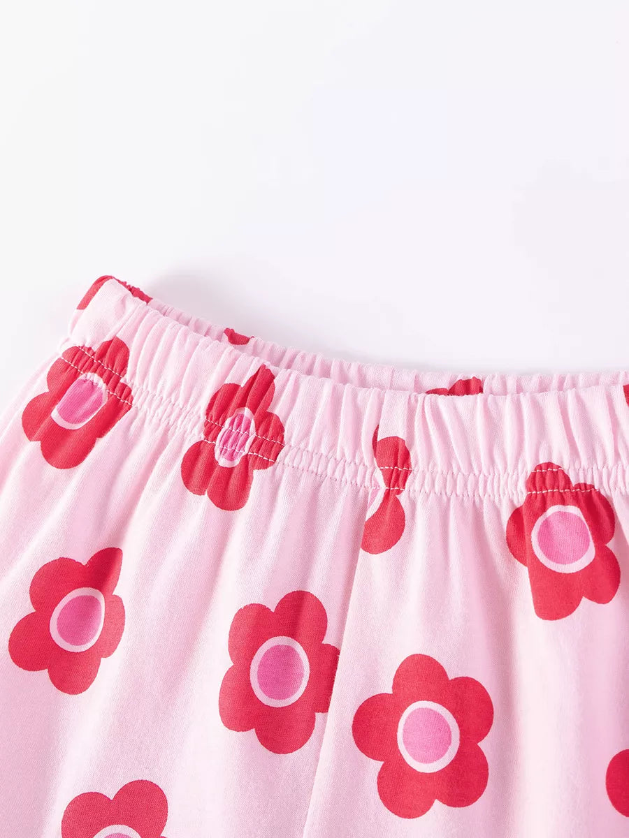 Pink baby shorts with red and pink flower print and elastic waistband