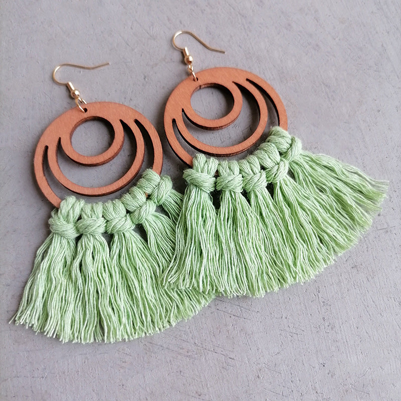 Macrame tassel and wood circle earrings in Gum Leaf with knotted detail.