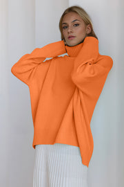 Orange cashmere turtleneck sweater with oversized cocoon fit and ribbed cuffs and hem.