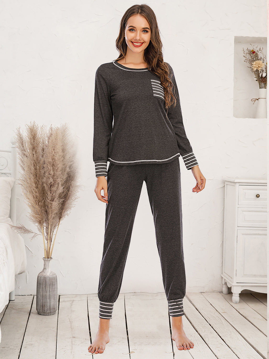 Charcoal loungewear set with white striped trim on cuffs, pocket, and hem.