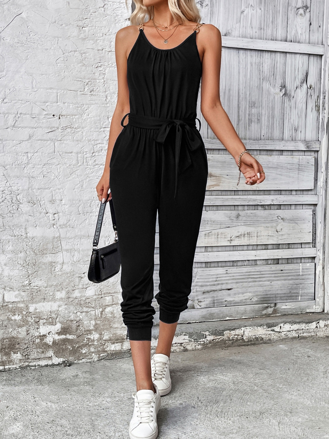 Black chain-strap gathered waist jumpsuit with tie belt and cuffed ankles