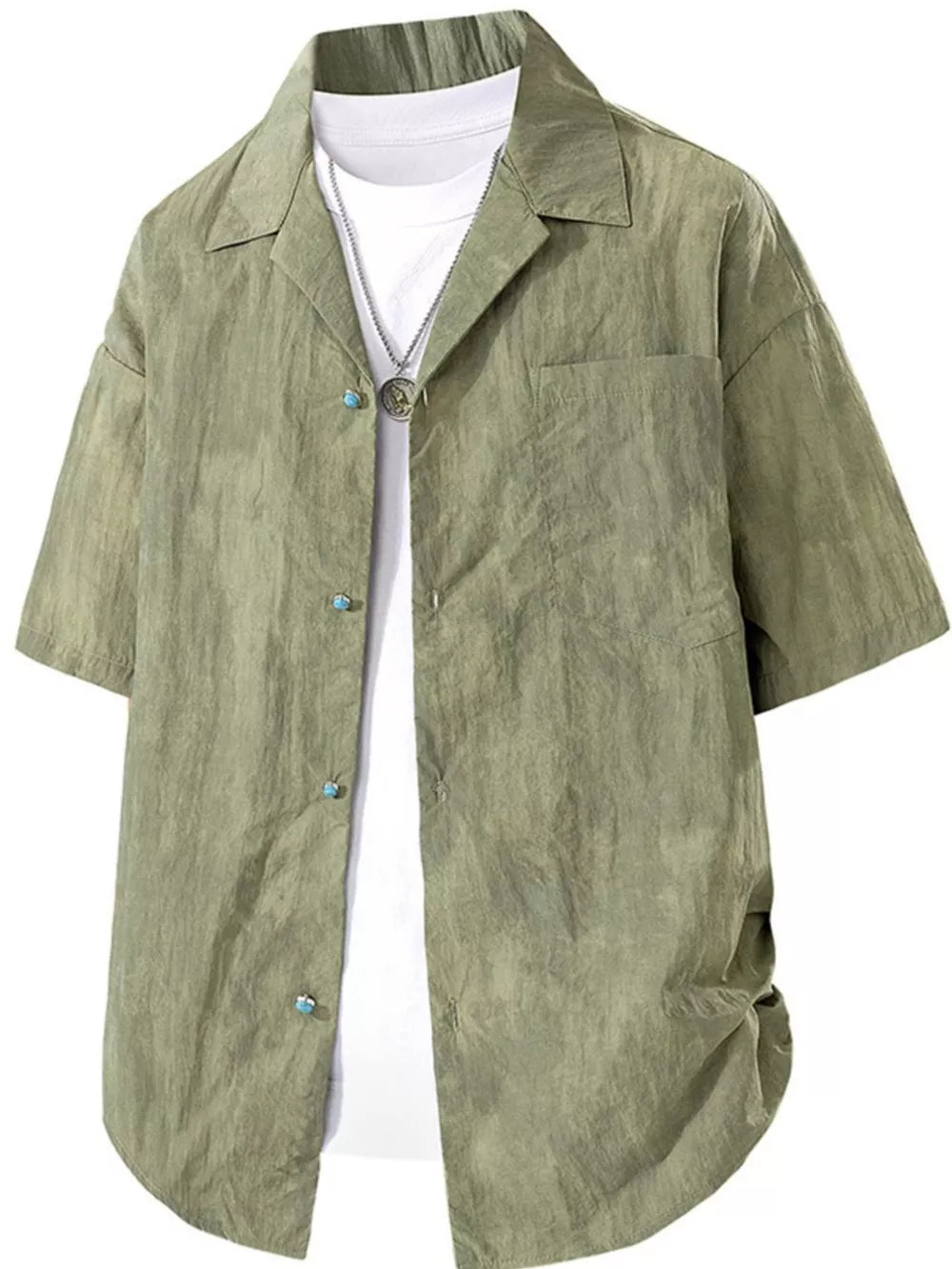 Relaxed fit military green camp collar shirt with button front and chest pocket, worn over a white tee.