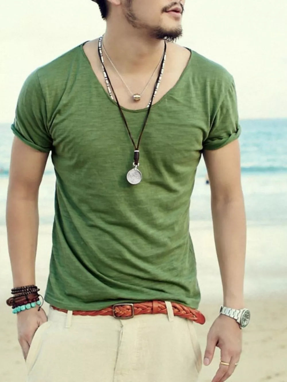 Men's relaxed fit scoop neck t-shirt in Grass Green cotton, short sleeves, beach casual style.