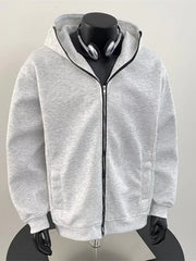 Men's grey zip-up hoodie with black zipper and pockets.